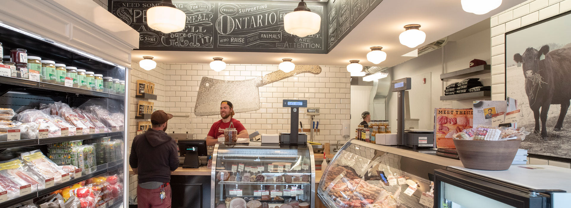 Inside Sanagan’s Meat Locker, with a customer at the butcher counter
